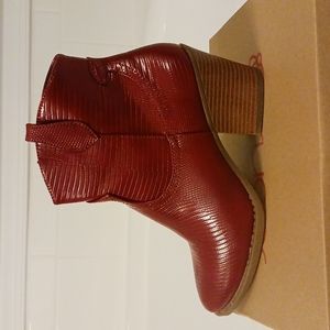 Brand new red leather booties.  Worn in the house to try on but too small